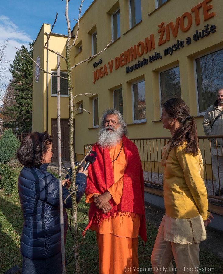 interview in front of the ashram and peace tree  small