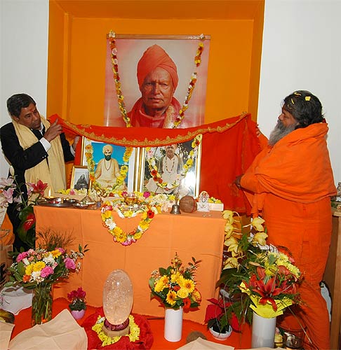 His Holiness Swamiji offered Holy Guruji's orange and gold shawl, as a vivid symbol of Guruji's presence in this ashram